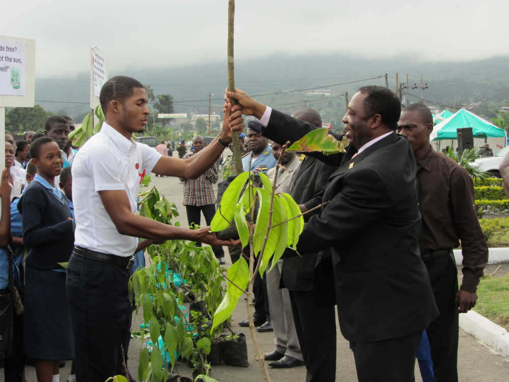 Secretary General at the Governor’s office, Mr Quetong Anderson Handing Trees to the Youths
