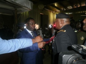  Minister of Defense, Edgard Alain Mebe Ngo (L) congratulates Col Gabriel Mvogo from Cameroon after decoratng him