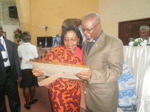  Dr Nalova Lyonga congratulates Moderator Emeritus of the PCC, Nyansako-Ni-Nku for his award for Religious Excellence