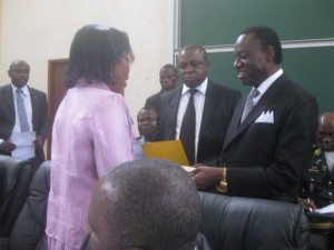 Jacques Fame Ndongo (right) hands over to Dr. Nalova Lyonga 