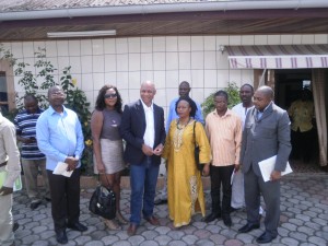 Dr Fred Kemah (in dark suit) in a family picture with journalists after the press briefing