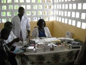 Pharmacy Attendants sorting out drugs for distribution 