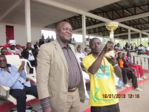 Southwest Governor Bernard Okalia Bilai, handed trophy to Tiku Divine Enyong