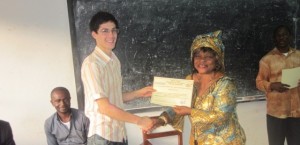 American Peace Corps Volunteer, handing certificate