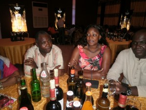 (L-R) Buea DO Kuam Mrs Onana and Mr Onana savouring the package from Les Brasseries Du Cameroun