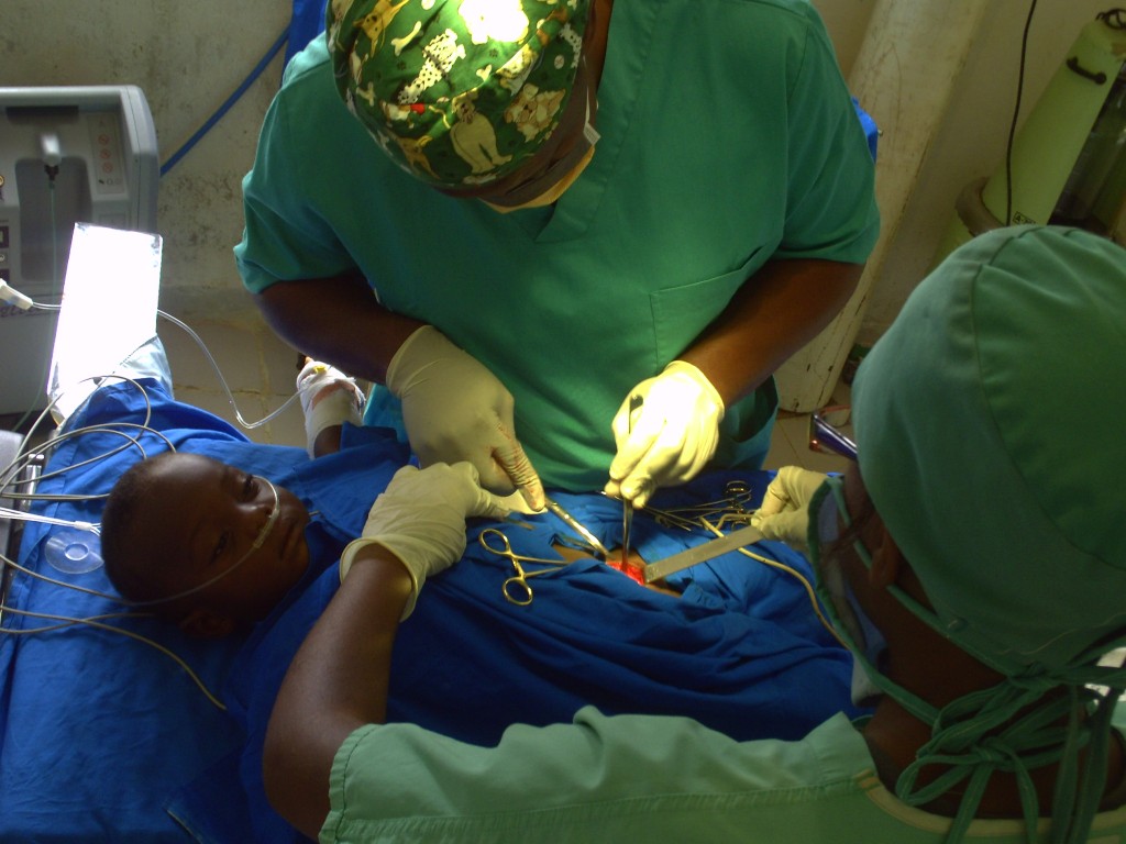 Dr Georges Bwelle (in green theatre ware) doing what he knows how to best - surgical operations