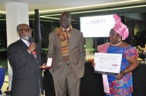 L-R, HE Lejeune Mbella Mbella, Cameroon's Ambassador to France(with mic) CRTV General Manager, Vamoulke and Tabe Enonchong at the URTI Awards ceremony