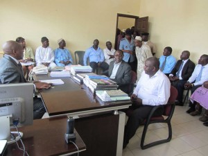 The Divisional Officer (behind desk) for Tiko, Mr.  Che PATRICK Ngwashiri, Mayor Daniel Ndande white shirt (front desk) 