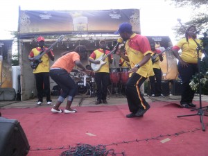 Les Brasseries du Cameroun All Star Band jigging it out with a participant