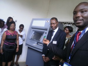 Alphonse Shang, Buea Branch Manager of Ecobank(1st from right) explains how the Ecobank ATM machine works