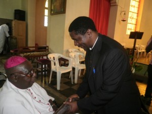 Mgr. Nkea(R) extends a hand of love to his Bishop Emeritus, Pius Suh Awa of Buea Diocese after his appointment on July 10 2013