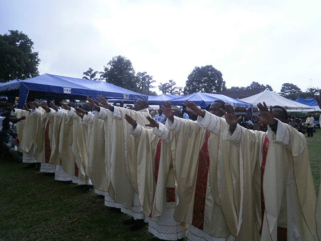 The newly ordained Priests bless the christians who turned out for their ordination ceremony