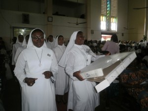Sr. Florence Mary(carrying gift) is joined by fellow Religious during the special offertory procession to the alta of God