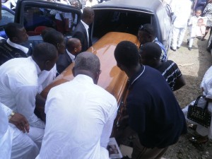 The casket of Dr Biaka being conveyed into the hearse by family members after reqiuem mass in his honour at the St. Anthony of Padua Catholic Church, Buea