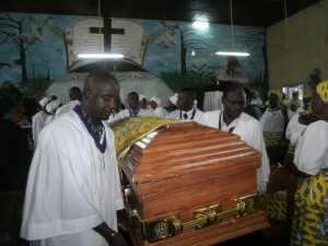 The casket of  Mrs Wenifred Teke being taken out of  PC Great Soppo by Elders of the Church after a funeral service in her honour