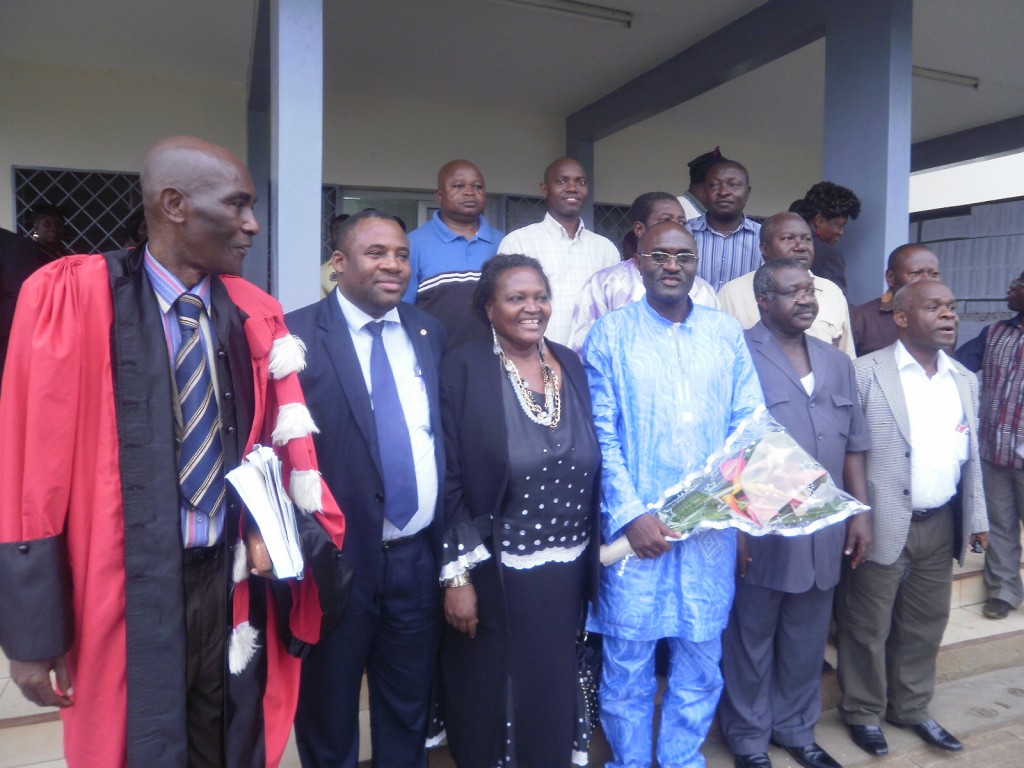 A family pic with some members of jury and staff of UB after the PhD Defence by Dr Henry Muluh (with bouqeut of flowers)